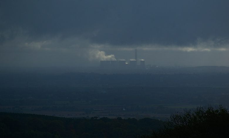 aerial photography of buildings viewing mountain under blue and gray sky