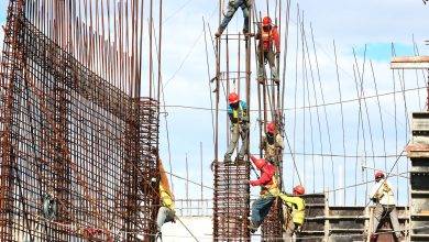 people working on building during daytime